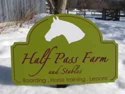 Custom equine farm sign with calligraphic carved letters